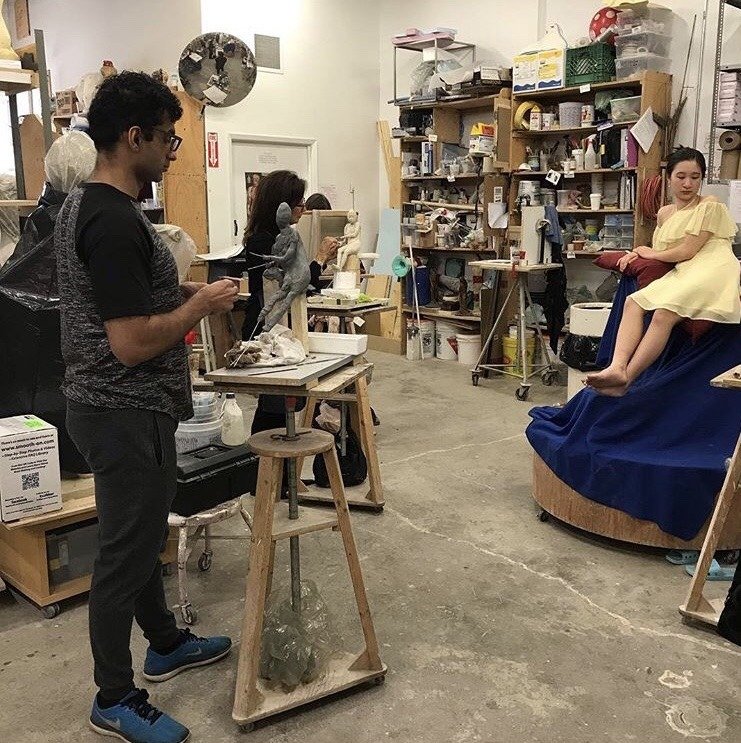 Figure sculpting session in the studio
